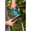 Corta-sebes elétrico Gardena ComfortCut 550/50, 50 cm, lâmina dupla, 2,7 cm, laranja, preto, azul, 2,6 m/s², 84 dB