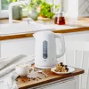 Chaleira elétrica Adler AD 1379w — 1,7 L, até 2200 W, branca, base 360°, polipropileno