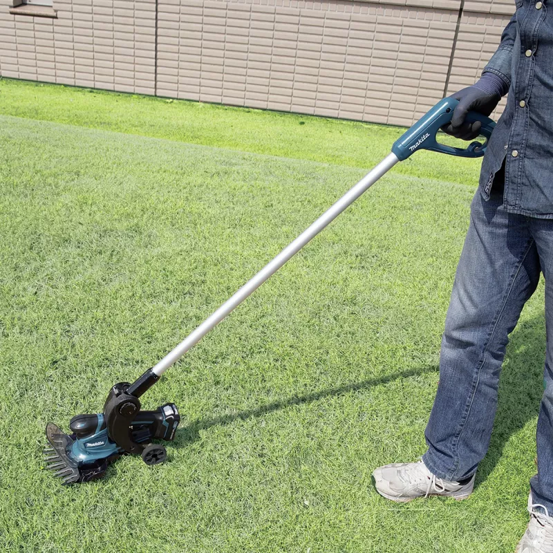 UM600DSMEX Tesoura de relva sem fio 10,8 V azul preto 2x bateria de iões de lítio 4,0 Ah