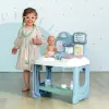 Centro de cuidados para bebé Smoby Baby Care Center Modelo 2024 240305 com acessórios e funções interativas