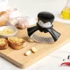 Espremedor de alho de mesa Ototo Design Rockula plástico aço inoxidável preto branco