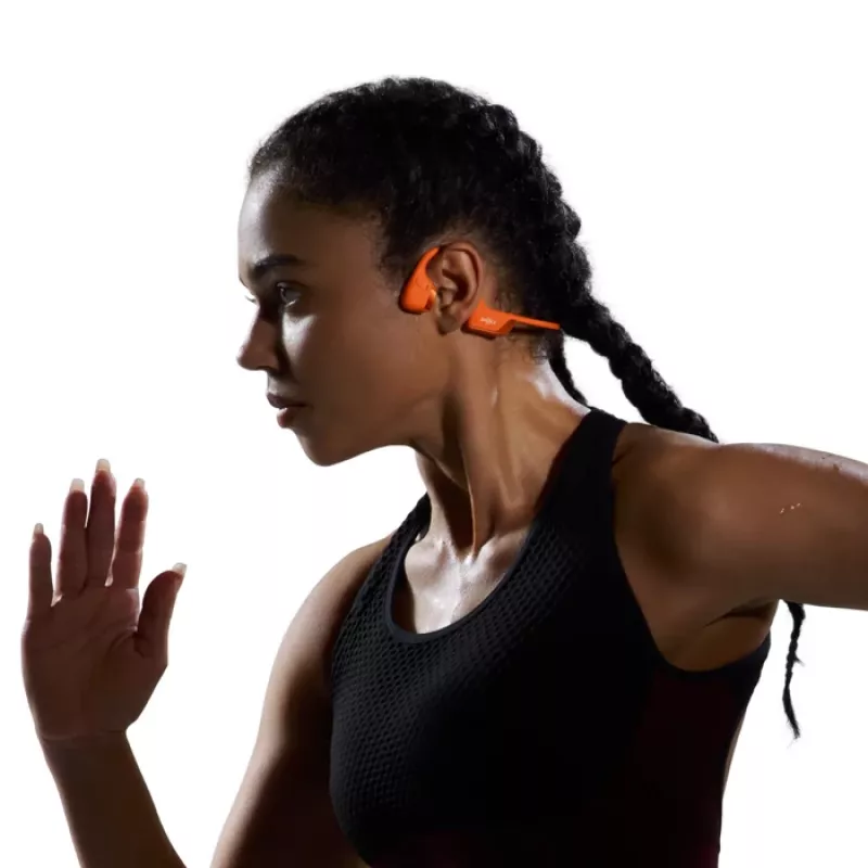 Auscultadores de condução óssea Shokz OpenRun Pro 2 — binaural, sem fios Bluetooth 5.3, IP55, 12 h de reprodução, 150 mAh, laranja, gancho de orelha