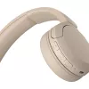 Auscultadores Sony WH-CH520 sem fios com arco para chamadas/música USB Type-C Bluetooth base de carregamento creme