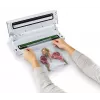 Máquina de vácuo FoodSaver VS0100X — botão rotativo, inclui rolo de filme e 4 sacos de vácuo, prateado-branco