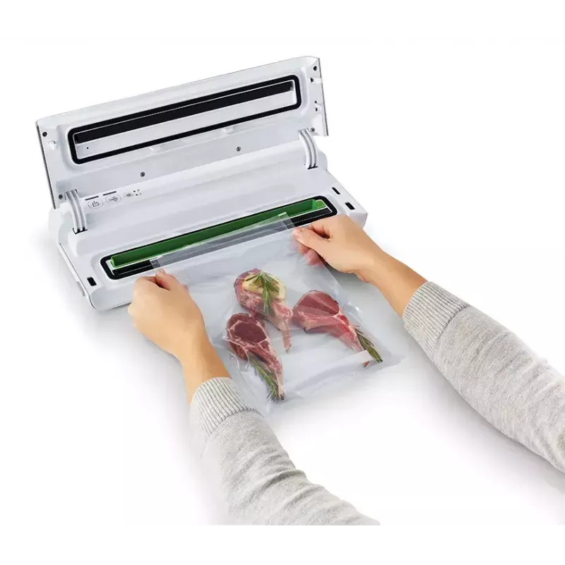 Máquina de vácuo FoodSaver VS0100X — botão rotativo, inclui rolo de filme e 4 sacos de vácuo, prateado-branco