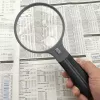 Lupa Carson Split Handle HF-11 — lupa de mão 3,5×, preto/transparente, pilha AAA