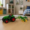 LEAN TOYS Trator telecomandado com ancinho de feno RC luzes 1:24