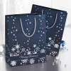SIGEL GT110 conjunto de sacos de presente flocos de neve prateados, pack de 3, papel revestido, asas de cordão têxtil brancas, brilho metálico, para Natal e inverno, 230 x 180 x 100 mm