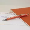 Esferográfica Schneider Epsilon laranja com tinta azul 138606